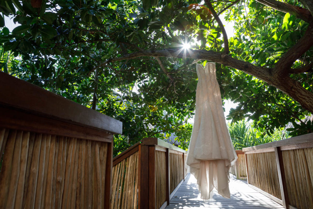 wedding dress hanging on a tree at Four Seasons resort Bora Bora