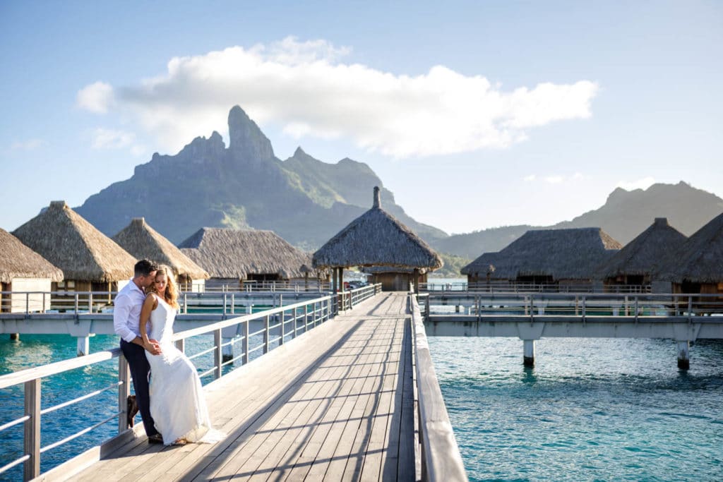 couple posing on the bungalow side