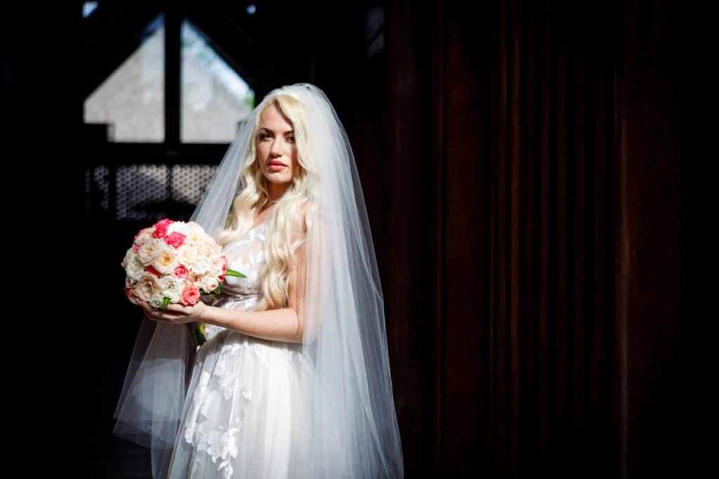 bora bora bride with a short round bouquet
