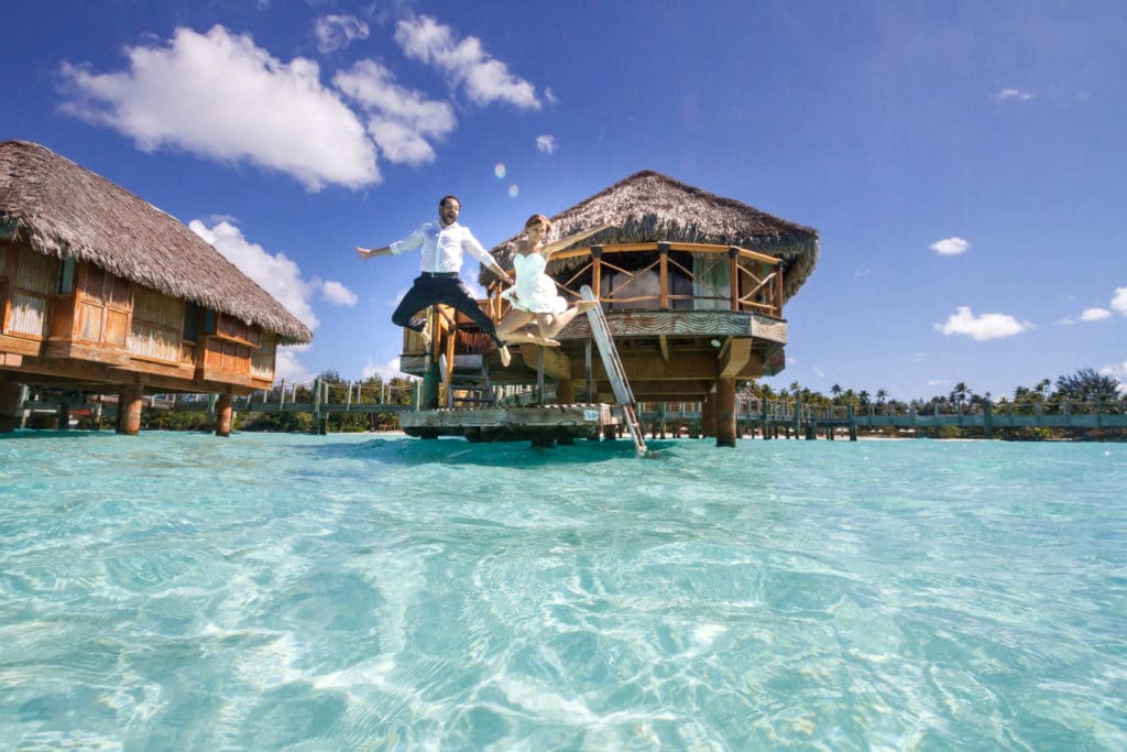 Lena & Austin jumping in the lagoon of Bora Bora