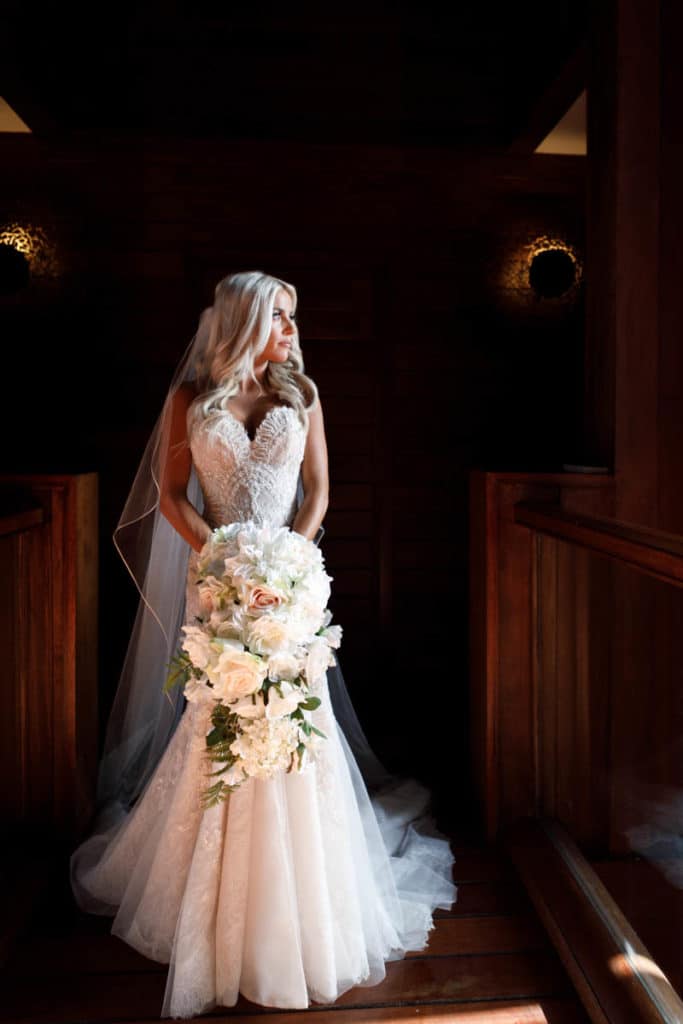bora bora bride with a long bouquet