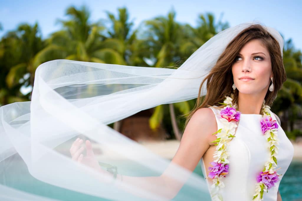 beautiful bora bora bride playing the veil