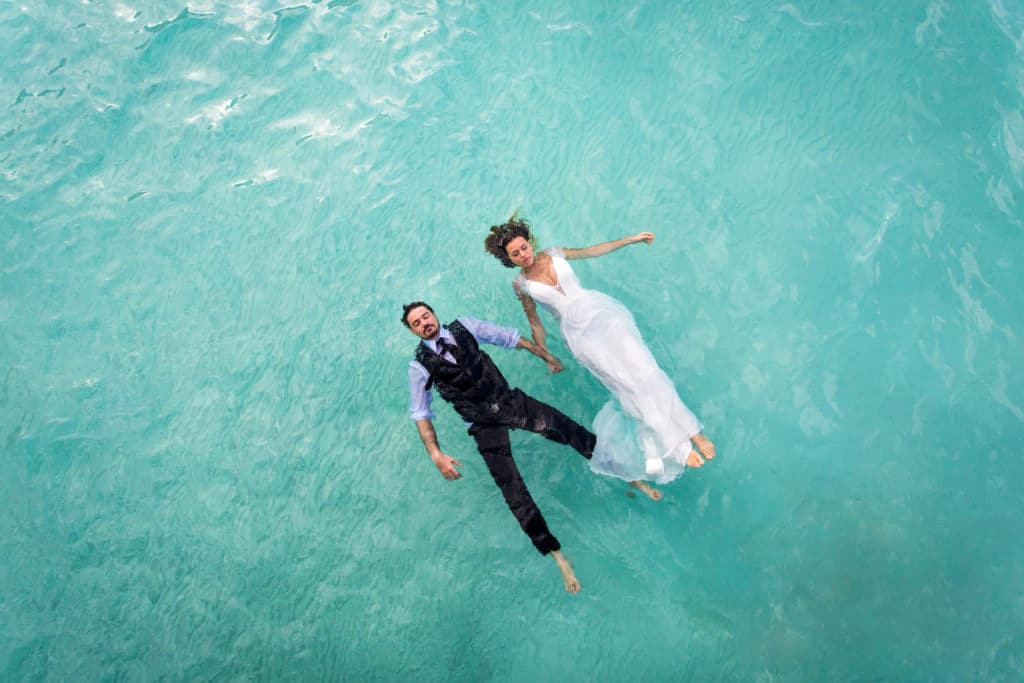 couple floating in the lagoon of Bora Bora