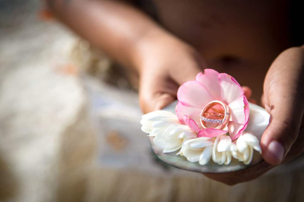 rings presented on top of flowers