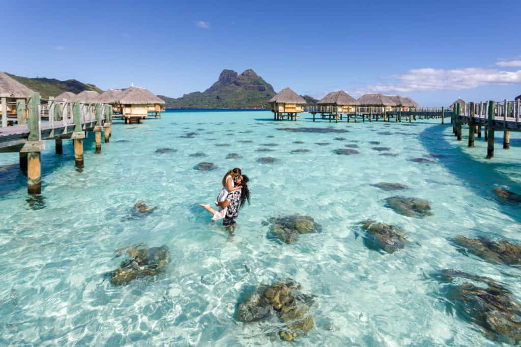 couple posing at pearl beach bora bora